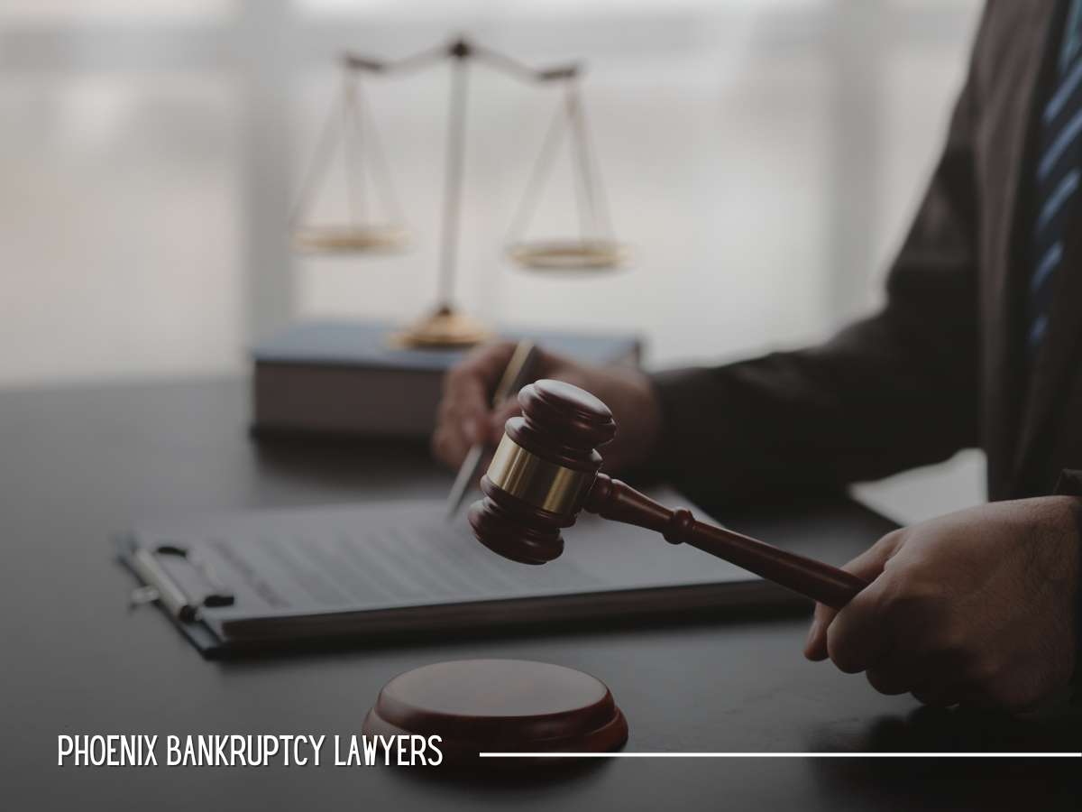 Image of a lawyer's hand holding a gavel in an office, representing the decision-making process in bankruptcy cases